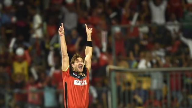 Royal Challengers Bangalore player Shane Watson celebrates the dismissal of Suresh Raina at a match in Bengaluru. He was auctioned for Rs. 9.5 Crore. (Hindustan Times) 
