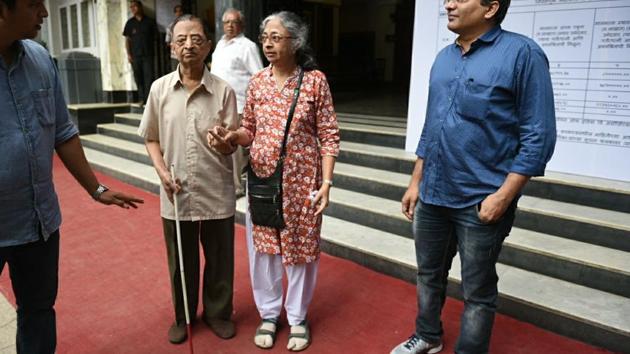 Visually challenged Vijaykumar Sanjgire, 80, with his sister, after casting vote at Balmohan Vidyamandir, Dadar. (Pratik Chorge/HT PHOTO)
