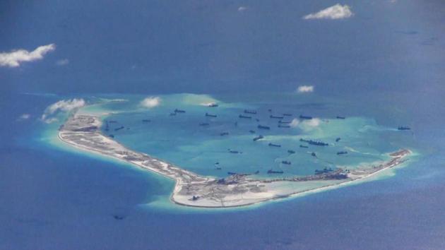 File photo of Chinese dredging vessels seen in waters around Mischief Reef in the disputed Spratly Islands in the South China Sea. This still image is from video taken by a P-8A Poseidon surveillance aircraft provided by the US Navy in 2015. (Reuters) File photo of Chinese dredging vessels seen in waters around Mischief Reef in the disputed Spratly Islands in the South China Sea. This still image is from video taken by a P-8A Poseidon surveillance aircraft provided by the US Navy in 2015. (Reuters)