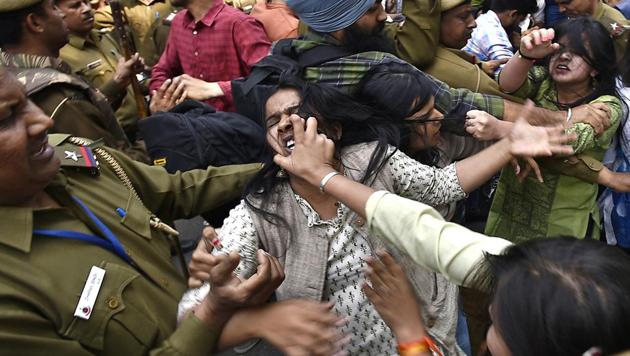 ABVP and AISA members fight with each other after a scuffle broke out between them. (Raj K Raj/HT PHOTO)