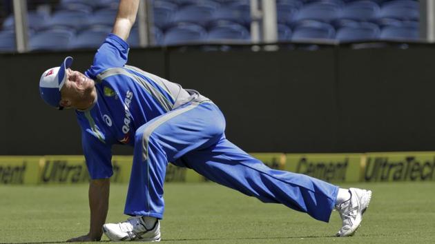 Australia's David Warner stretches during a practice session ahead of their first Test against India in Pune. (AP)