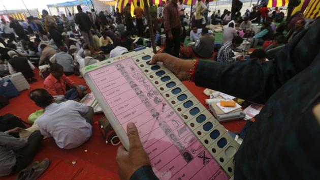 A polling officer checks an electronic voting machine before proceeding to a polling station in Allahabad in Uttar Pradesh. (AP Photo) A polling officer checks an electronic voting machine before proceeding to a polling station in Allahabad in Uttar Pradesh. (AP Photo)