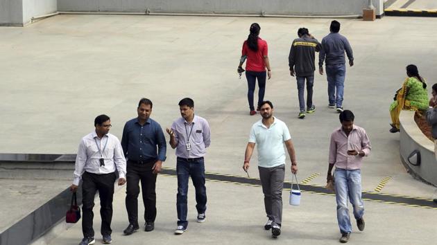 In this January 18 file photo, Wipro Ltd. employees walk inside the company's compound during a break at their headquarters in Bangalore.(AP) In this January 18 file photo, Wipro Ltd. employees walk inside the company's compound during a break at their headquarters in Bangalore.(AP)