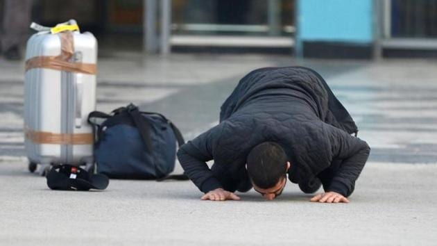 An Afghan, whose asylum application has been rejected, kisses the ground after he arrived from Germany in Kabul airport. (Reuters) An Afghan, whose asylum application has been rejected, kisses the ground after he arrived from Germany in Kabul airport. (Reuters)