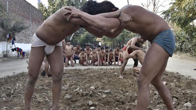 ‘Kushti’ in progress at Krishan Pehalwan Akhaara (P and T) facility in Amritsar on Wednesday. (Gurpreet Singh/HT Photo)