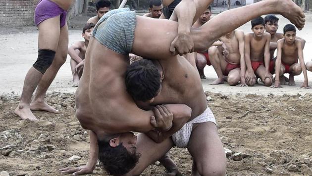 ‘Kushti’ in progress at Krishan Pehalwan Akhaara (P and T) facility in on Wednesday. (Gurpreet Singh/HT Photo)