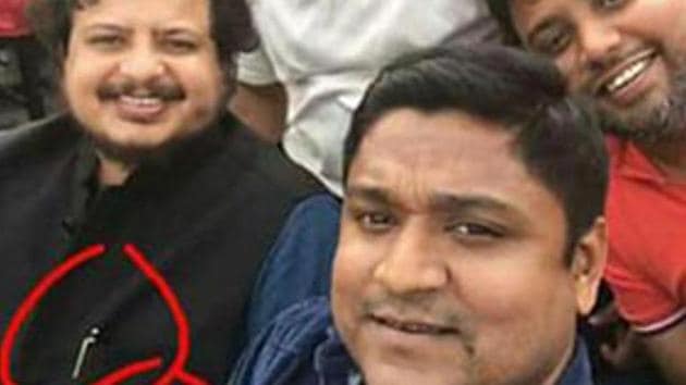 A photograph posted on social media shows CPM Rajya Sabha MP with his Apple watch and Mont Blanc pen circled in red. (Facebook) A photograph posted on social media shows CPM Rajya Sabha MP with his Apple watch and Mont Blanc pen circled in red. (Facebook)