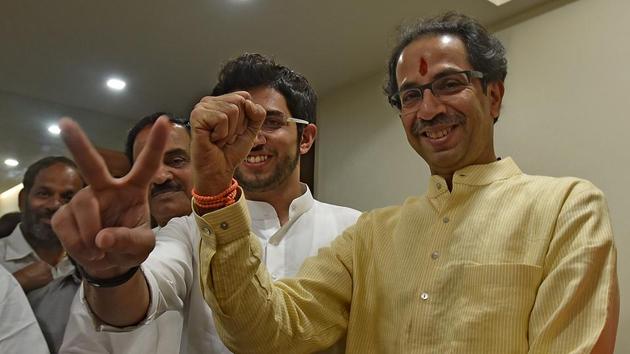 V FOR VICTORY: Shiv Sena chief Uddhav Thackeray and Yuva Sena president Aditya Thackeray interact with the media at  Matoshree in Bandra . (Vijayanand Gupta/HT PHOTO) 