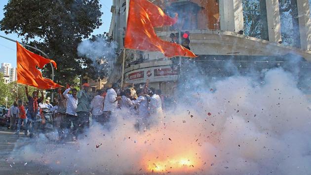 CRACKING UP: Sena supporters celebrate outside Sena Bhavan in Dadar. (Satyabrata Tripathy/HT Photo) 
