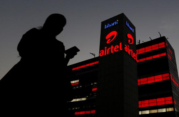 A girl checks her mobile phone as she walks past the Bharti Airtel office building in Gurugram, previously known as Gurgaon, on the outskirts of New Delhi, India April 21, 2016. (REUTERS) A girl checks her mobile phone as she walks past the Bharti Airtel office building in Gurugram, previously known as Gurgaon, on the outskirts of New Delhi, India April 21, 2016. (REUTERS)