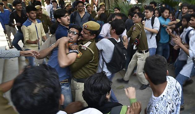 ABVP activists beating Ramjas students , after JNU student Umar Khalid’s visit to Ramjas College was cancelled following protests by students, on Wednesday.(Raj K Raj/HT PHOTO)