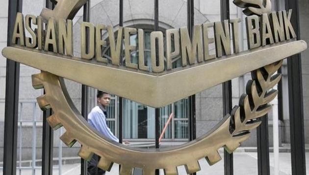 A worker walks past inside the Asian Development Bank (ADB) headquarters in Manila. (Reuters)
