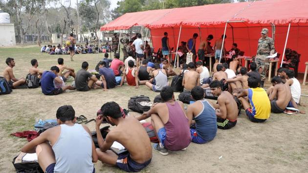 Aspirants awaiting instructions from during Army recruitment rally at 152 Infantry Battalion (Territorial Army) in Ludhiana on Thursday. (Gurminder Singh/HT Photo)
