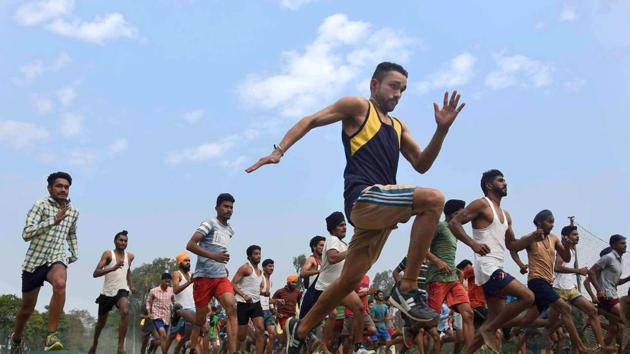 Aspirants take part in drills during Army recruitment rally at 152 Infantry Battalion (Territorial Army) in Ludhiana on Thursday. (Gurminder Singh/HT Photo)