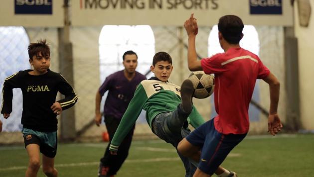 In this picture taken on Sunday, Feb. 19, 2017, Syrian refugee boys fight for the ball during a soccer game at a private sports club, southern Beirut, Lebanon. (AP Photo) In this picture taken on Sunday, Feb. 19, 2017, Syrian refugee boys fight for the ball during a soccer game at a private sports club, southern Beirut, Lebanon. (AP Photo)