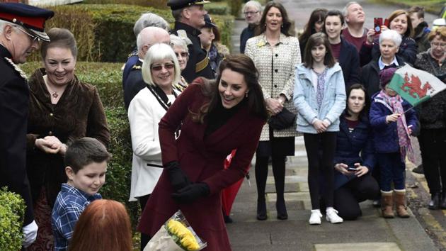 Britain's Catherine, Duchess of Cambridge, interacts with children at the Palm Suite, in Pontypool. (Rebecca Naden / REUTERS)