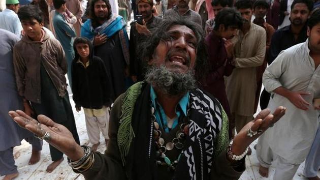 A man mourns the death of a relative who was killed in a suicide blast at the shrine of Sufi saint Lal Shahbaz Qalandar, on February 18, in Sehwan Sharif, Pakistan's southern Sindh province.(REUTERS/Akhtar Soomro)