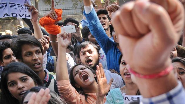 ABVP members shout slogans against AISA and Umar Khalid in the Art Faculty of Delhi University campus, in New Delhi, India, on Thursday, February 23, 2017. Memebrs of the group said that they are against anti-nationals and will continue to protest one day after clashes broke out between two student organizations outside Ramjas college campus yesterday in Delhi University. (Burhaan Kinu/HT PHOTO)