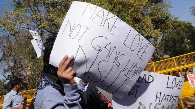 NSUI protested at The Faculty of Arts, Delhi University Campus and carried out a peace march. (Burhaan Kinu/HT PHOTO)