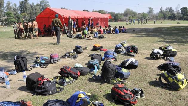 elongings of aspirants lying on the ground as they take part in Army recruitment rally at 152 Infantry Battalion (Territorial Army) in Ludhiana on Thursday. (Gurminder Singh/HT Photo)