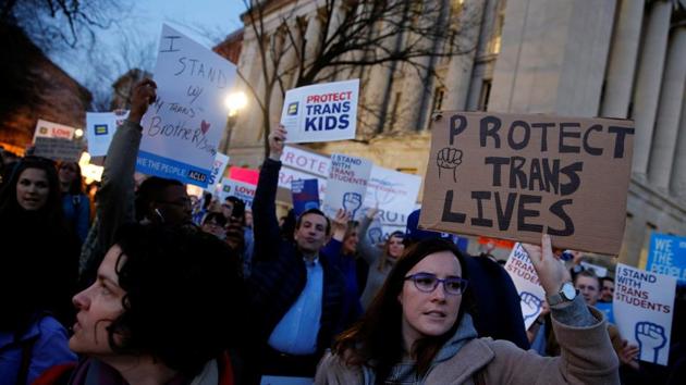 Transgender activists and supporters protest potential changes by the Trump administration in federal guidelines issued to public schools in defence of transgender student rights, near the White House in Washington on February 22. (REUTERS) Transgender activists and supporters protest potential changes by the Trump administration in federal guidelines issued to public schools in defence of transgender student rights, near the White House in Washington on February 22. (REUTERS)