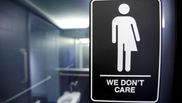 A sign protesting a recent North Carolina law restricting transgender bathroom access is seen in the bathroom stalls at the 21C Museum Hotel in Durham, North Carolina.(Reuters)