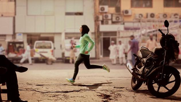 Zahra Lari runs in a scene shot for the Nike Middle East ad campaign filmed in Dubai.(REUTERS)