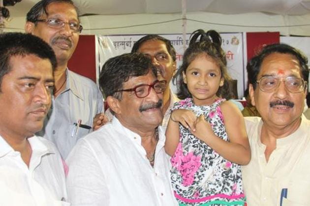BJP candidate Atul Shah with his lucky girl Yashika Salunke, who lifted the lottery chit and Raj Purohit after he beat Shiv Sena Candidate Surendra Bagalkar in the tie for the corporation election at the Gilder Road Municipal School in Grant road counting center after Tie between them, in Mumbai, India, on Thursday, 23 Feb, 2016. (Photo by Bhushan Koyande/HT)(Bhushan Koyande)