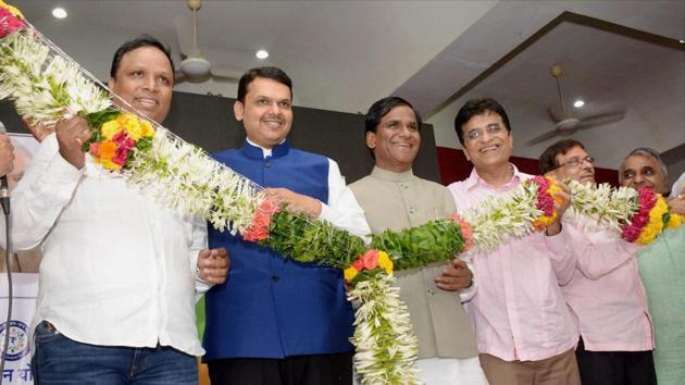 Chief Minister of Maharashtra Devendra Fadanvis and party state president Ravsaheb Danve along with Ashis Selar, Kirit Somaiya and other leaders being garlanded during celebrations after the BMC poll results at Mumbai BJP office on Thursday. (PTI Photo) Chief Minister of Maharashtra Devendra Fadanvis and party state president Ravsaheb Danve along with Ashis Selar, Kirit Somaiya and other leaders being garlanded during celebrations after the BMC poll results at Mumbai BJP office on Thursday. (PTI Photo)