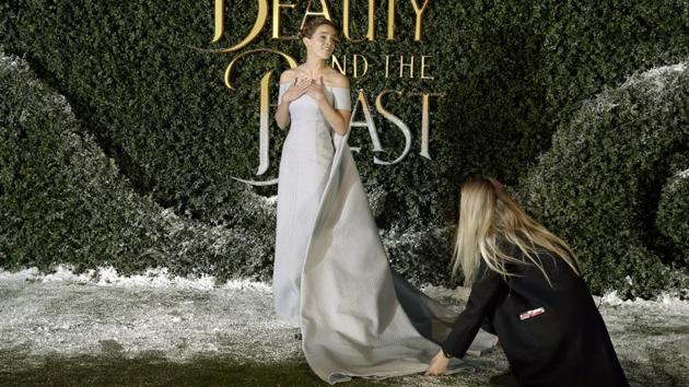 The dress had a massive train that required quite some rearranging for the photo-ops. (AP)