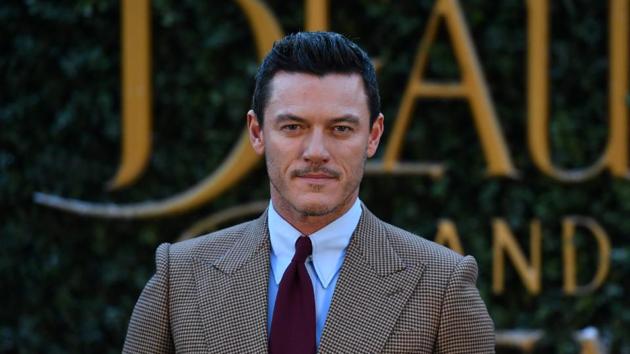 Welsh actor Luke Evans gelled-up hair are to swoon-worthy. He plays the villain, Gaston in the film. (AFP)