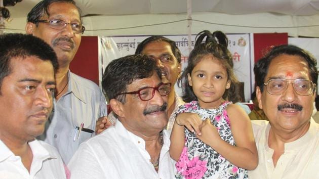 BJP candidate Atul Shah with his lucky girl, Yashika Salunke ( who lifted the lottery chit), and others at the Gilder Road Municipal School at the Grant Road counting centre. (Bhushan Koyande) BJP candidate Atul Shah with his lucky girl, Yashika Salunke ( who lifted the lottery chit), and others at the Gilder Road Municipal School at the Grant Road counting centre. (Bhushan Koyande)