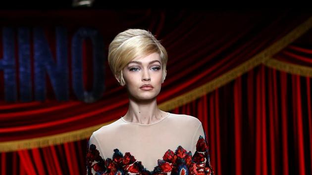 Model Gigi Hadid presents a creation from Moschino's Autumn/Winter 2017 women's collection.(REUTERS)