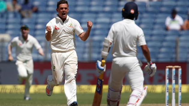 Australia's Steve O'Keefe celebrates the wicket of India's Ajinkya Rahane on Day 2 of the first Test in Pune. The left-arm spinner took six wickets for 35.(REUTERS)