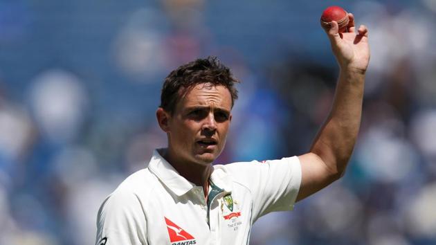 Australia’s Steve O’Keefe holds up the ball after taking six wickets in India’s first innings, in Pune on Friday.(REUTERS)