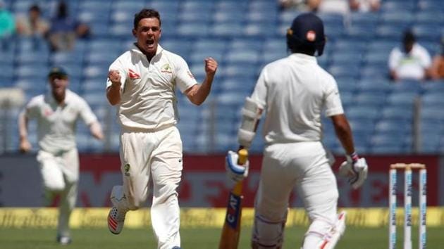 Australia's Steve O'Keefe celebrates the wicket of India's Ajinkya Rahane.(REUTERS)