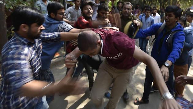 ABVP members beat Ramjas College students following violent agitations over Umar Khalid being invited to address students at an event titled ‘The culture of protest’.(Raj K Raj/HT PHOTO)