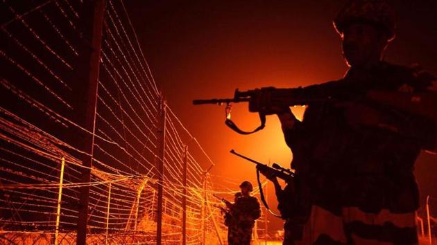 In this file photograph taken on January 17, 2013, Border Security Force (BSF) soldiers patrol along a border fence at an outpost along the Line of Control (LOC) between India-Pakistan at Abdulian, some 38 kms southwest of Jammu. (AFP) In this file photograph taken on January 17, 2013, Border Security Force (BSF) soldiers patrol along a border fence at an outpost along the Line of Control (LOC) between India-Pakistan at Abdulian, some 38 kms southwest of Jammu. (AFP)