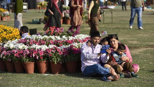 A family poses for a selfie on the first day of Noida flower show. (Virendra Singh Gosain/HT Photo) A family poses for a selfie on the first day of Noida flower show. (Virendra Singh Gosain/HT Photo)