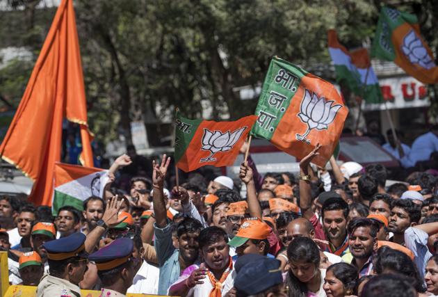 Shiv Sena and BJP flags fly high while votes are counted in a municipal school at Andheri on Thursday. (Satish Bate/HT PHOTO)