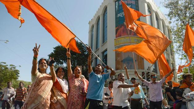 Shiv Sena members celebrate after their victory in the BMC elections in Mumbai on Thursday. (AFP) Shiv Sena members celebrate after their victory in the BMC elections in Mumbai on Thursday. (AFP)