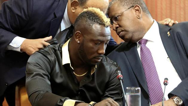 West Indies all-rounder Andre Russell during a meeting of an independent anti-doping tribunal at the Jamaica Conference Centre next to his lawyers, in Kingston on January 31.(REUTERS)