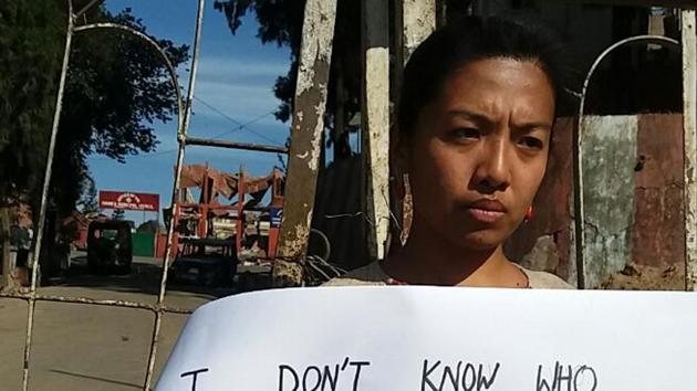 Kohima resident Rugotsono Iralu outside the burnt Kohima Municipal building on Sunday. Chief Minister T. R. Zeliang was forced to resign in the wake of the turmoil in Nagaland over his proposal to reserve 33 % of the seats in the urban civic polls for women that were scheduled for February 1 Kohima resident Rugotsono Iralu outside the burnt Kohima Municipal building on Sunday. Chief Minister T. R. Zeliang was forced to resign in the wake of the turmoil in Nagaland over his proposal to reserve 33 % of the seats in the urban civic polls for women that were scheduled for February 1