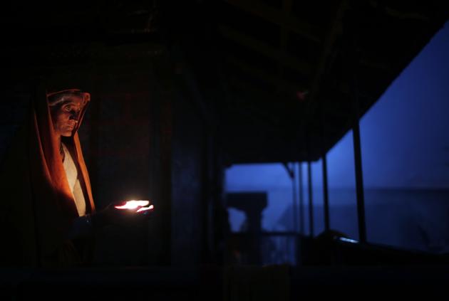 A Hindu holy woman lights an oil lamp during Shivaratri festival in Kathmandu, Nepal, Friday, Feb. 24, 2017. Shivaratri, or the night of Shiva, is dedicated to the worship of Lord Shiva, the Hindu god of death and destruction.(AP Photo/Niranjan Shrestha) (AP) A Hindu holy woman lights an oil lamp during Shivaratri festival in Kathmandu, Nepal, Friday, Feb. 24, 2017. Shivaratri, or the night of Shiva, is dedicated to the worship of Lord Shiva, the Hindu god of death and destruction.(AP Photo/Niranjan Shrestha) (AP)
