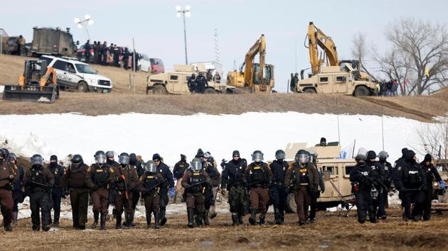 Law enforcement officers advance into the main opposition camp against the Dakota Access oil pipeline near Cannon Ball, North Dakota, U.S. (Terray Sylvester/REUTERS)