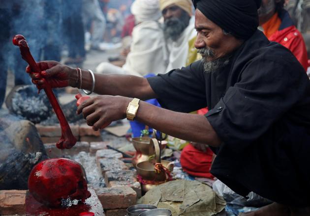 A Hindu holy man, or sadhu, offers prayers on a human skull at the premises of Pashupatinath Temple during the Shivaratri festival in Kathmandu, Nepal February 24, 2017. REUTERS/Navesh Chitrakar (REUTERS) A Hindu holy man, or sadhu, offers prayers on a human skull at the premises of Pashupatinath Temple during the Shivaratri festival in Kathmandu, Nepal February 24, 2017. REUTERS/Navesh Chitrakar (REUTERS)