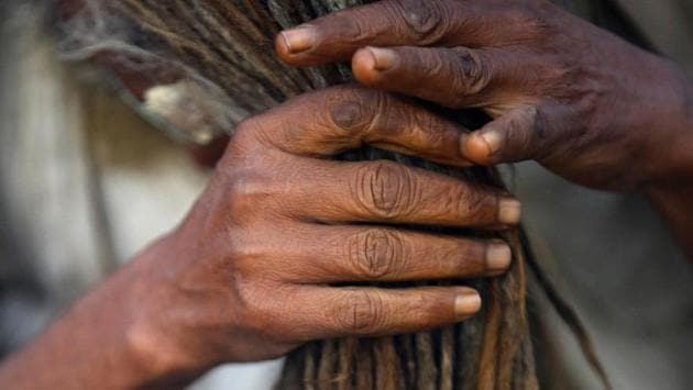 A Hindu holy man, or sadhu, arranges his hair at the premises of Pashupatinath Temple. (Navesh Chitrakar/REUTERS) A Hindu holy man, or sadhu, arranges his hair at the premises of Pashupatinath Temple. (Navesh Chitrakar/REUTERS)