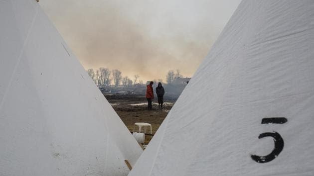 Two youths were injured at the camp Wednesday, apparently from the fires, officials said, including a teenage girl who was hospitalized with severe burns. (Nick Cote/NYT)