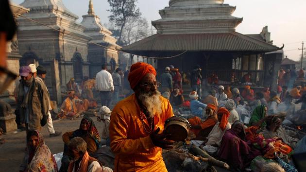 A sadhu sings and dances at the Pashupatinath Temple premises in Kathmandu on Mahashivratri. (REUTERS) A sadhu sings and dances at the Pashupatinath Temple premises in Kathmandu on Mahashivratri. (REUTERS)