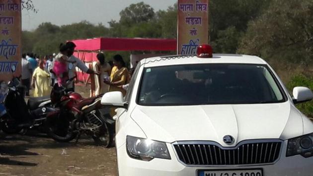 Navi Mumbai Mayor Sudhakar Sonawane’s car parked near the encroached land, where people constructed a temporary structure to celebrate Mahashivratri on Friday. (HT PHOTO) Navi Mumbai Mayor Sudhakar Sonawane’s car parked near the encroached land, where people constructed a temporary structure to celebrate Mahashivratri on Friday. (HT PHOTO)
